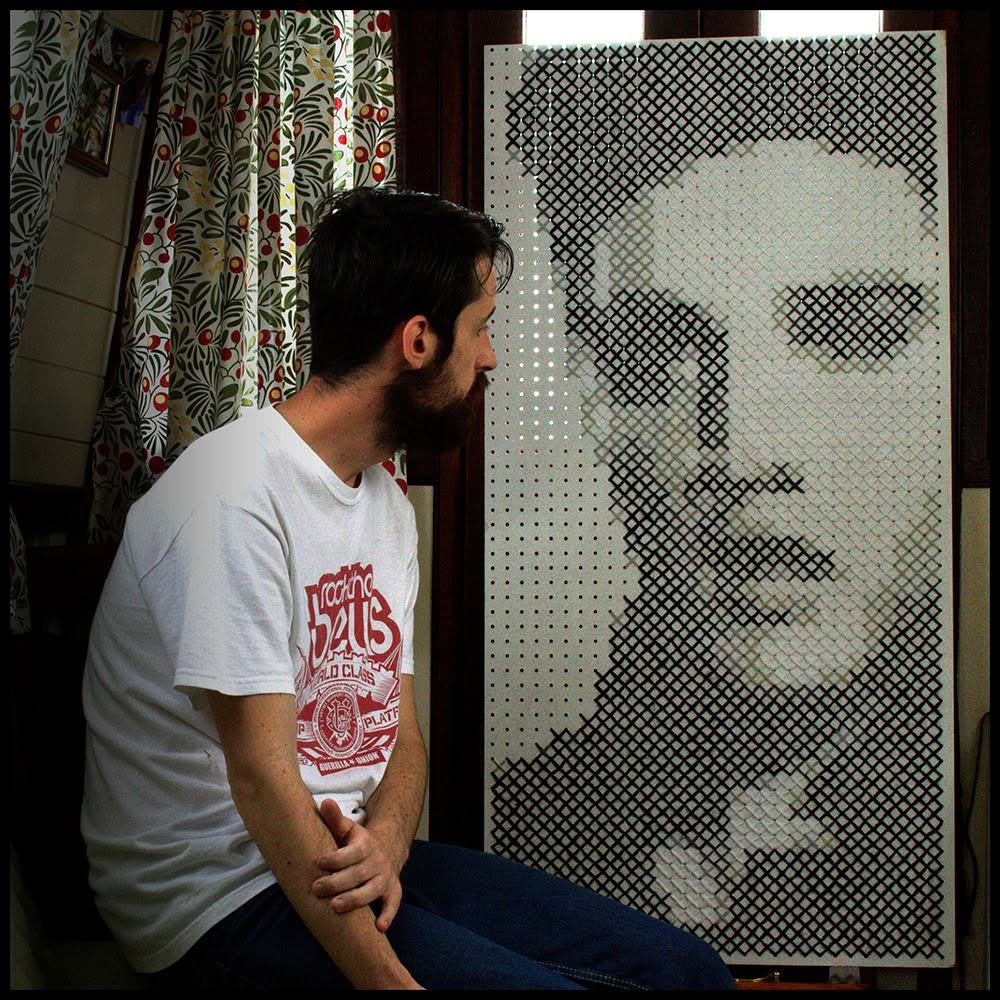A large format cross-stitch of Elvis.