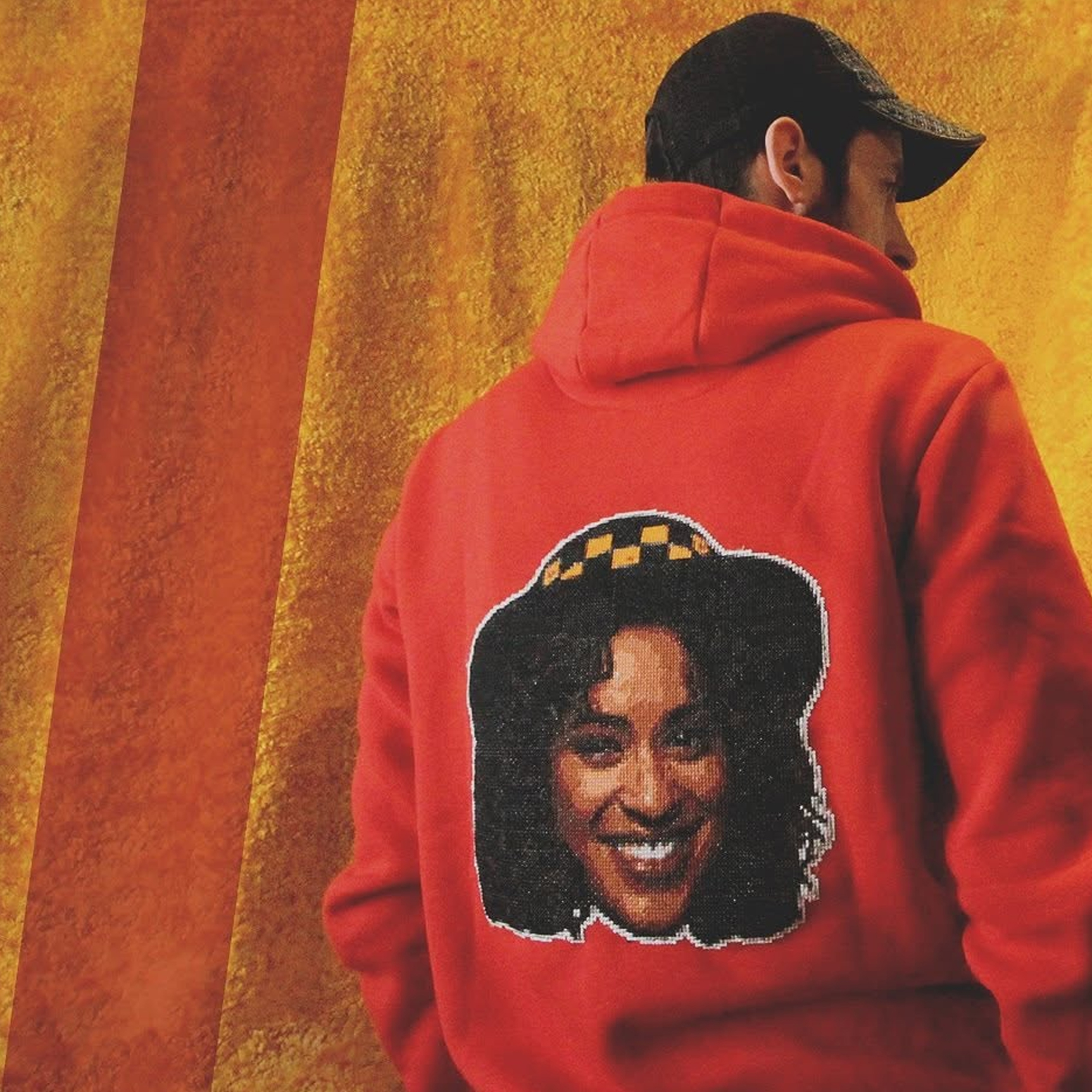 A cross-stitch of Hillary, from the Fresh Prince of Bel Air, on a jumper.